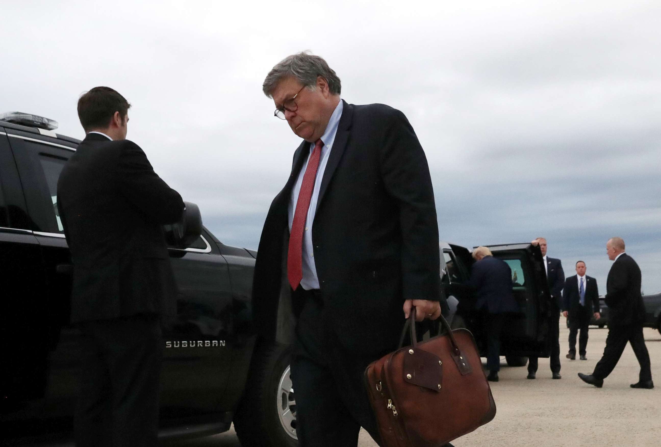 PHOTO: U.S. Attorney General Bill Barr and President Donald Trump walk to their cars  after landing at Joint Base Andrews, Maryland, Sept. 1, 2020.