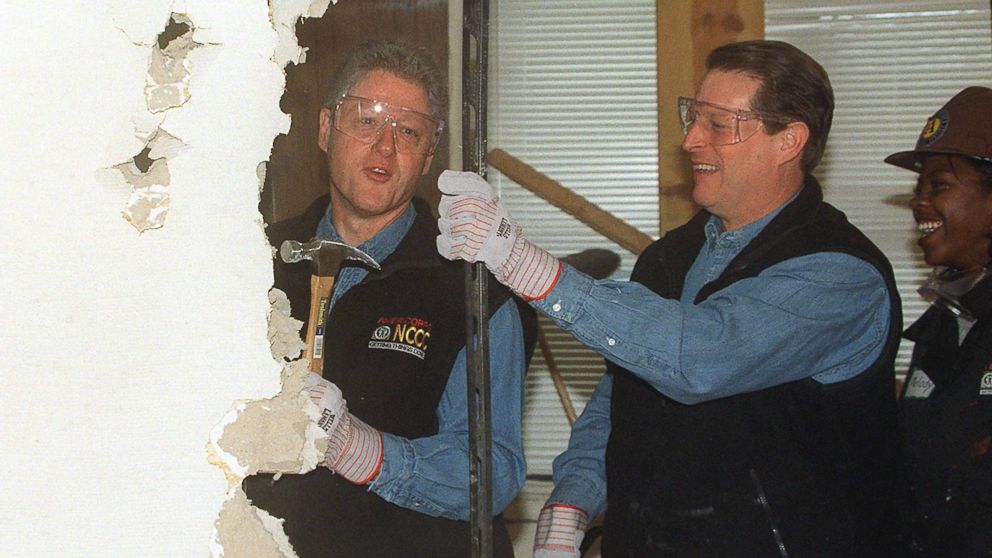 PHOTO: President Bill Clinton, Vice President Al Gore tear down a wall to begin renovation of the Regency House, a senior health center, Jan. 18, 1999 in Washington. 