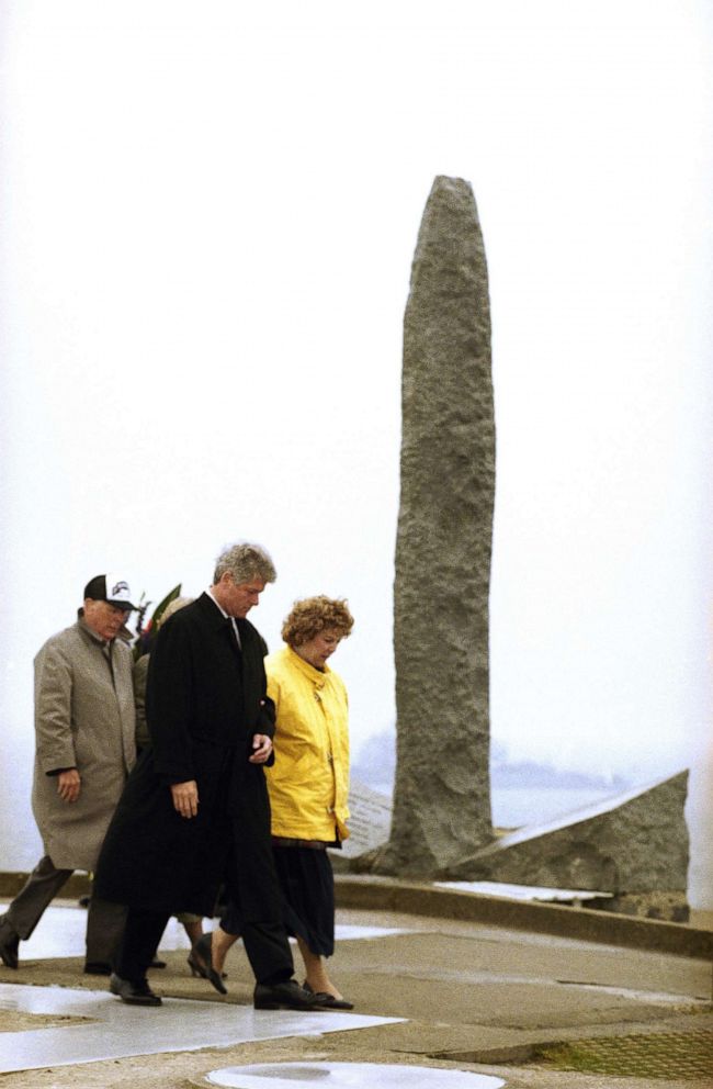 PHOTO: President Bill Clinton escorts Linda Williams, whose father, Lt. Col. James Rudder, led the storming of Pointe-du-Hoc on the coast of Normandy during the Allied invasion, at a D-Day ceremony in France, June 6, 1994.