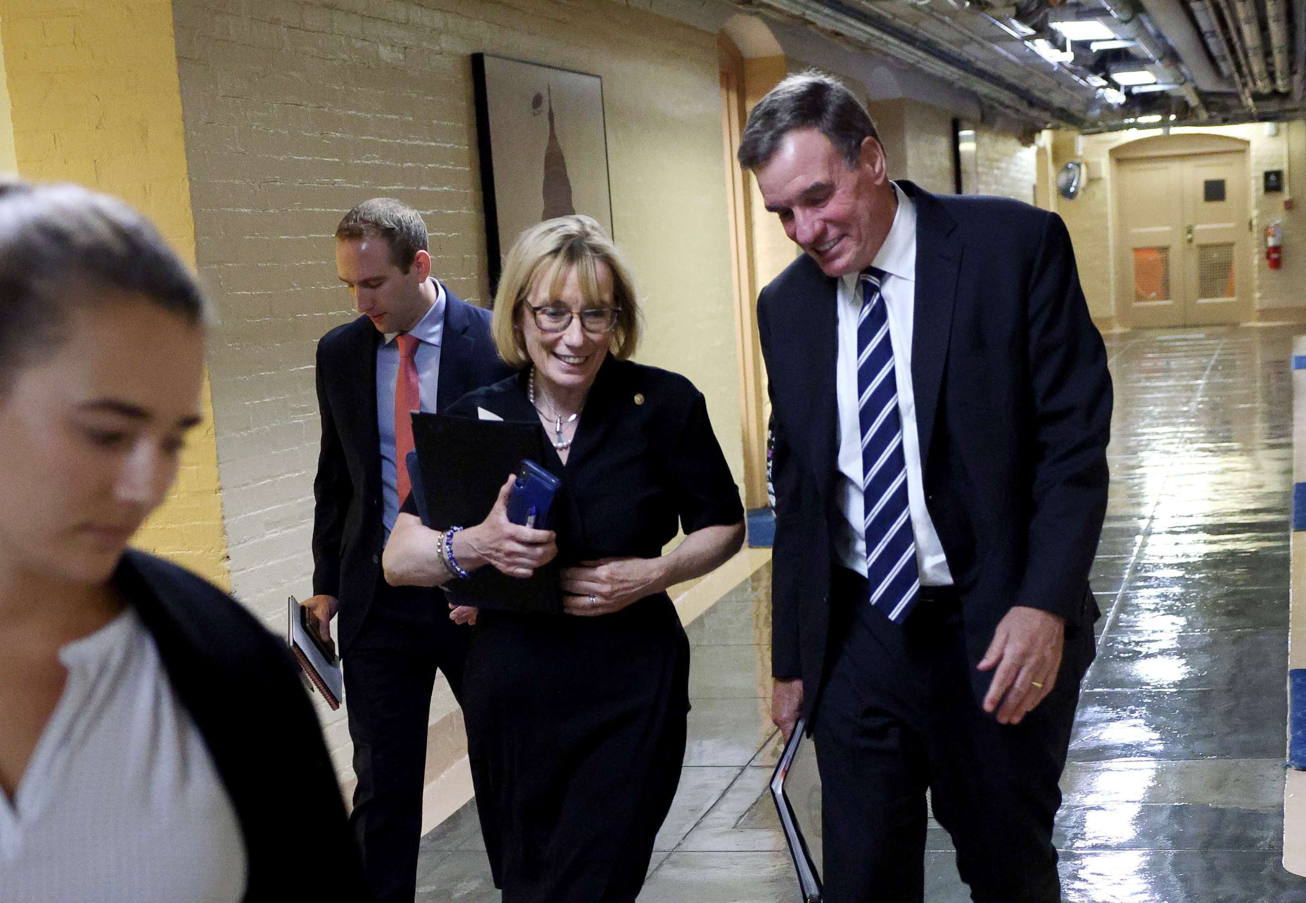 PHOTO: Sen. Mark Warner and Sen. Maggie Hassan leave a bipartisan meeting on infrastructure at the U.S. Capitol on July 13, 2021, in Washington, D.C.