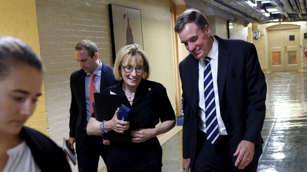 PHOTO: Sen. Mark Warner and Sen. Maggie Hassan leave a bipartisan meeting on infrastructure at the U.S. Capitol on July 13, 2021, in Washington, D.C.