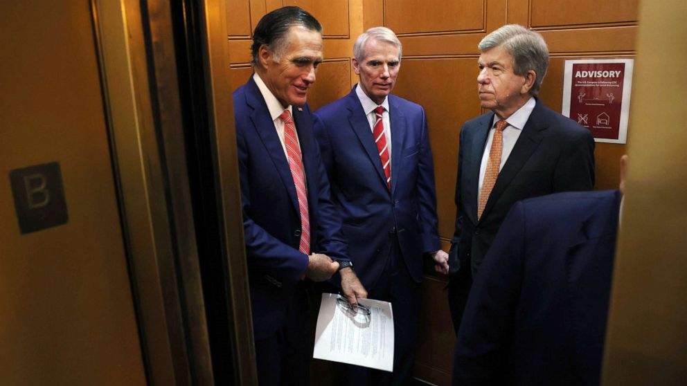 PHOTO: Sen. Mitt Romney, Sen. Rob Portman and Sen. Roy Blunt ride an elevator as they leave a bipartisan meeting on infrastructure at the U.S. Capitol on July 13, 2021, in Washington, D.C.