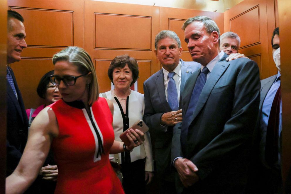 Sens. Mitt Romney, Kyrsten Sinema, Susan Collins, Joe Manchin and Mark Warner depart after attending a bipartisan work group meeting on an infrastructure bill at the U.S. Capitol on June 8, 2021.