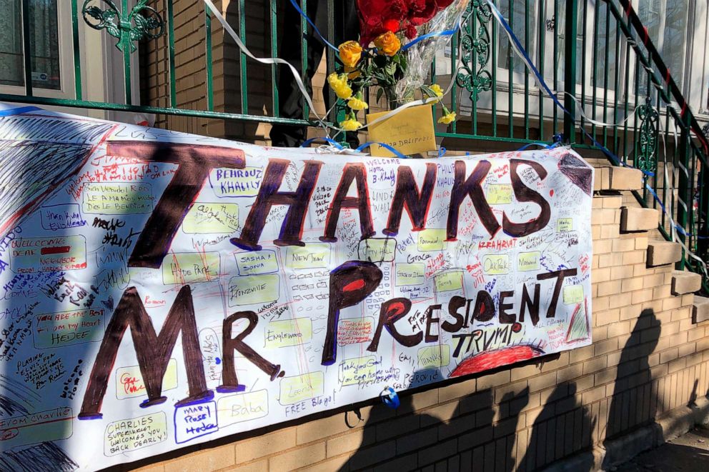 PHOTO: A large banner reading, "Thanks Mr. President," adorns the porch of the home of former Ill. Gov. Rod Blagojevich as members of the media prepare for a news conference with with him, Feb. 19, 2020, in Chicago.
