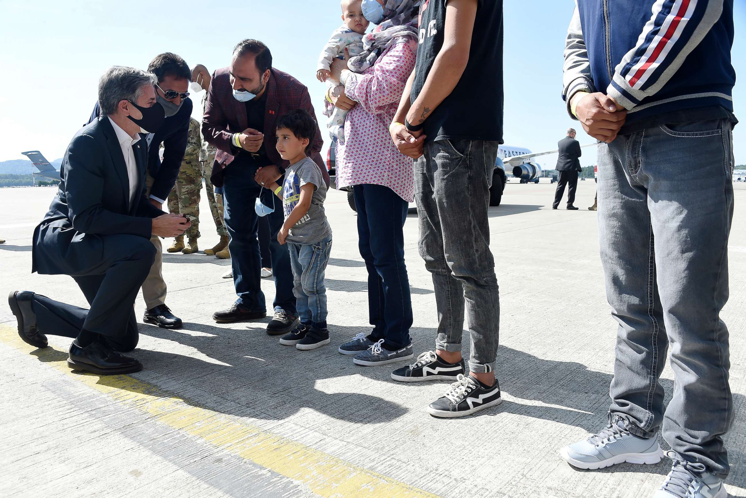 PHOTO: Secretary of State Antony Blinken meets with an Afghan refugee family outside Hangar 5 for evacuation operations at Ramstein Air Base Germany, Sept. 8, 2021. 