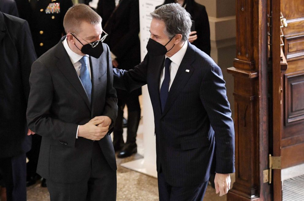 PHOTO: Secretary of State Antony Blinken, right, greets Latvia's Foreign Minister Edgars Rinkevics at the National Art Museum in Riga, Latvia, March 7, 2022.