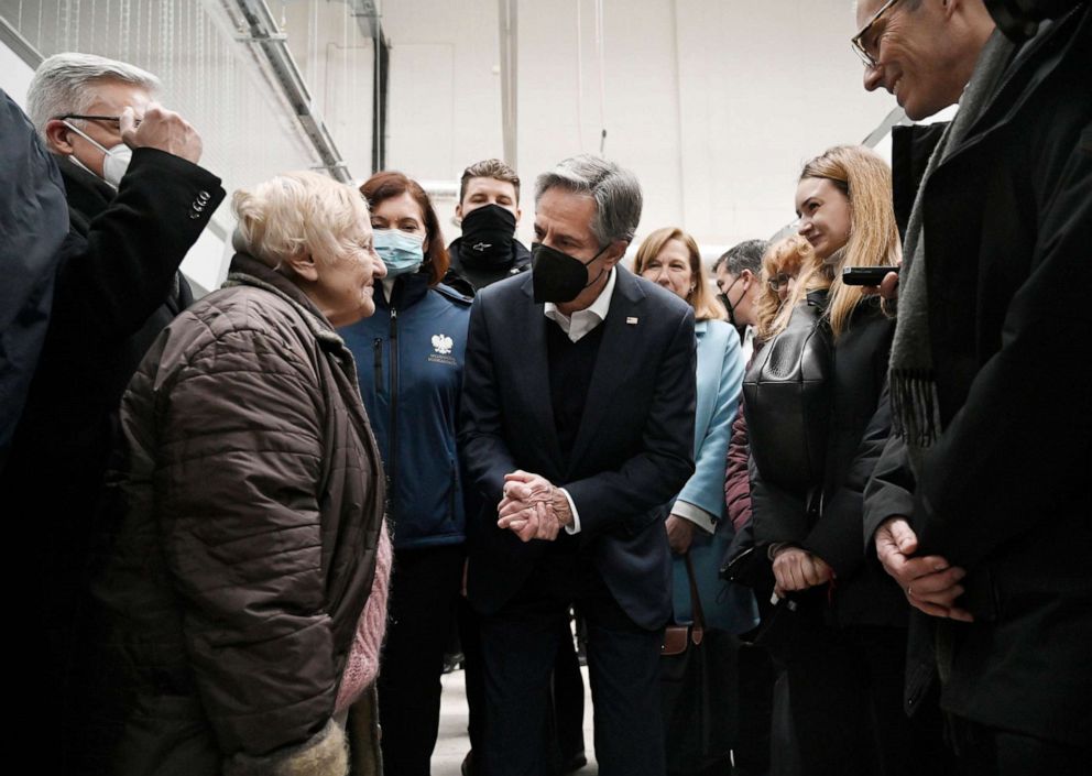 PHOTO: U.S. Secretary of State Antony Blinken, center, speaks with a woman as he tours a reception center, for displaced persons from Ukraine, at the Ukrainian-Polish border crossing in Korczowa, Poland, on March 5, 2022.