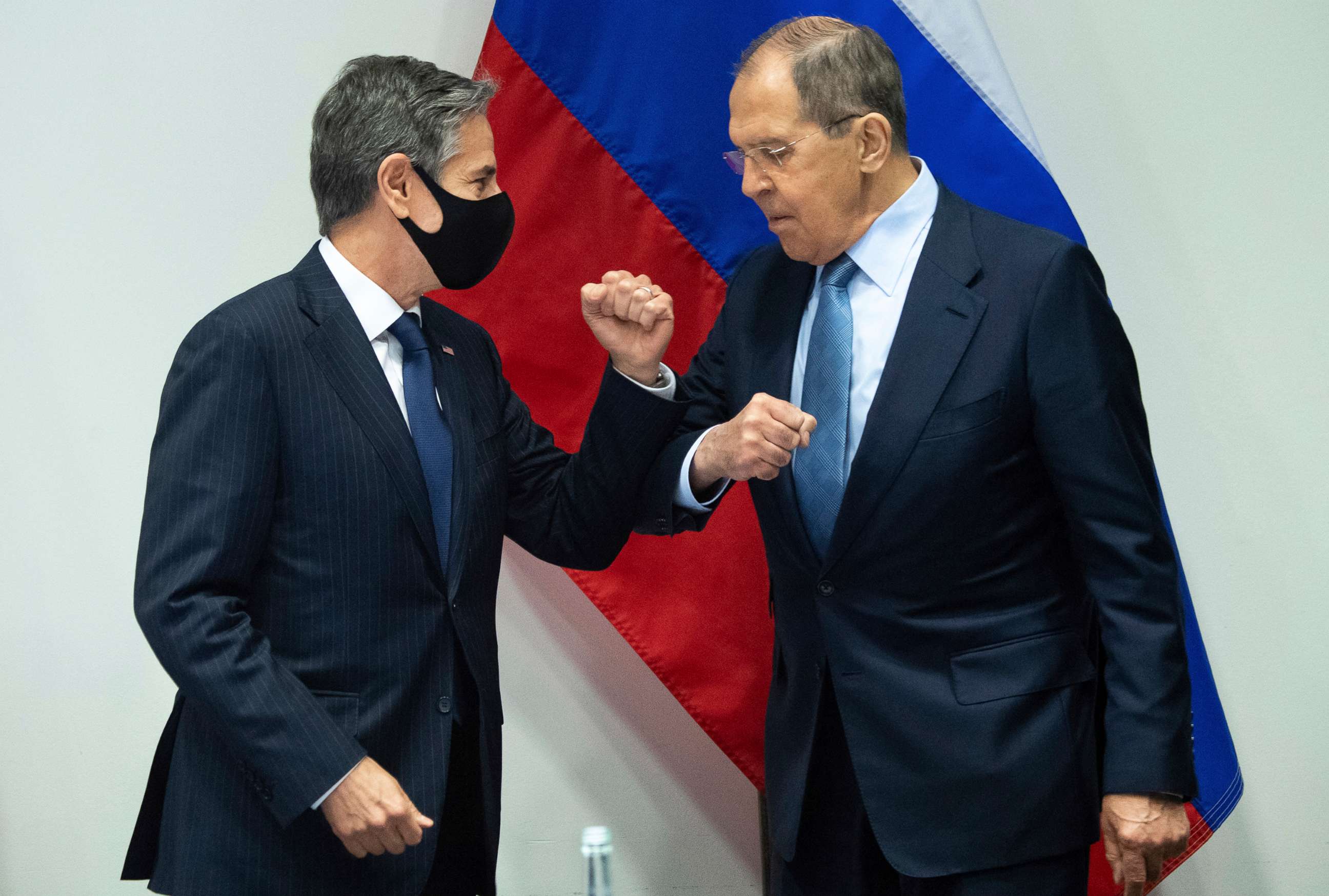 PHOTO: Secretary of State Antony Blinken, left, greets Russian Foreign Minister Sergey Lavrov, right, as they arrive for a meeting at the Harpa Concert Hall in Reykjavik, Iceland, May 19, 2021, on the sidelines of the Arctic Council Ministerial summit. 
