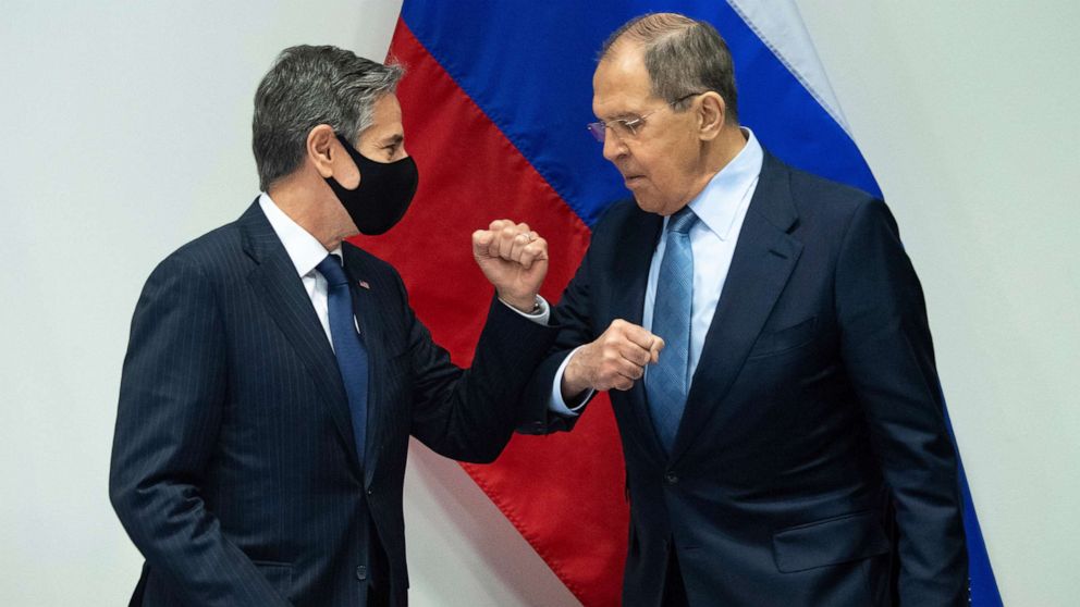 PHOTO: Secretary of State Antony Blinken, left, greets Russian Foreign Minister Sergey Lavrov, right, as they arrive for a meeting at the Harpa Concert Hall in Reykjavik, Iceland, May 19, 2021, on the sidelines of the Arctic Council Ministerial summit. 