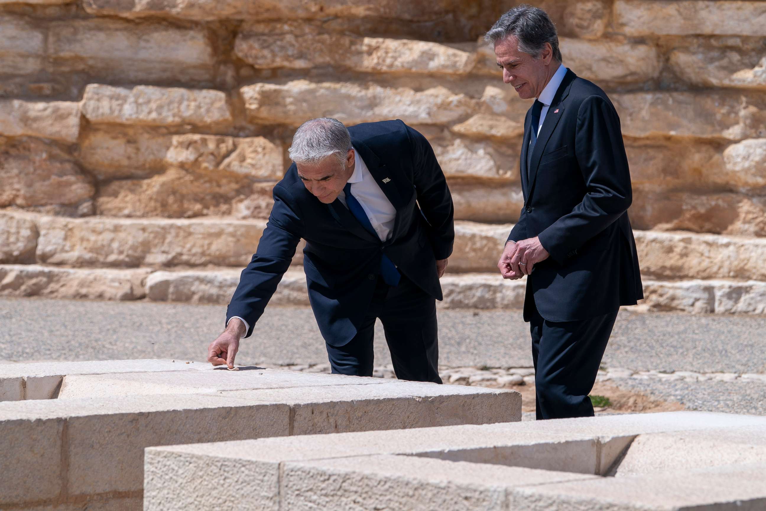 PHOTO:After meeting for the Negev Summit, Israel's Foreign Minister Yair Lapid, and U.S. Secretary of State Antony Blinken place stones on the grave of David Ben Gurion, while visiting David Ben Gurion National Park, March 28, 2022, in Sde Boker, Israel. 