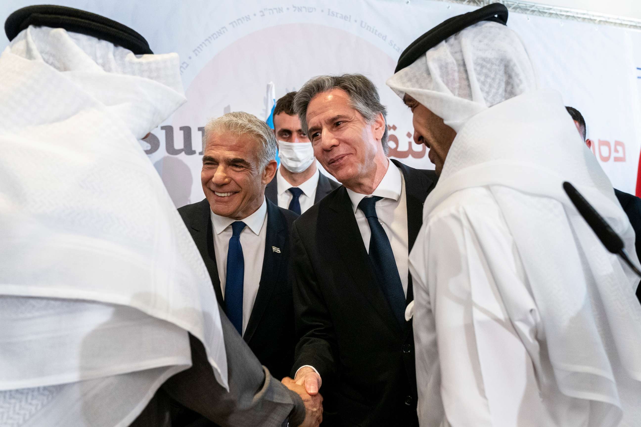 PHOTO: Yair Lapid, center left, and Antony Blinken, shake hands with Abdullatif bin Rashid al-Zayani, front left, and United Arab Emirates' Foreign Minister Sheikh Abdullah bin Zayed Al Nahyan, front right, March 28, 2022, in Sde Boker, Israel.