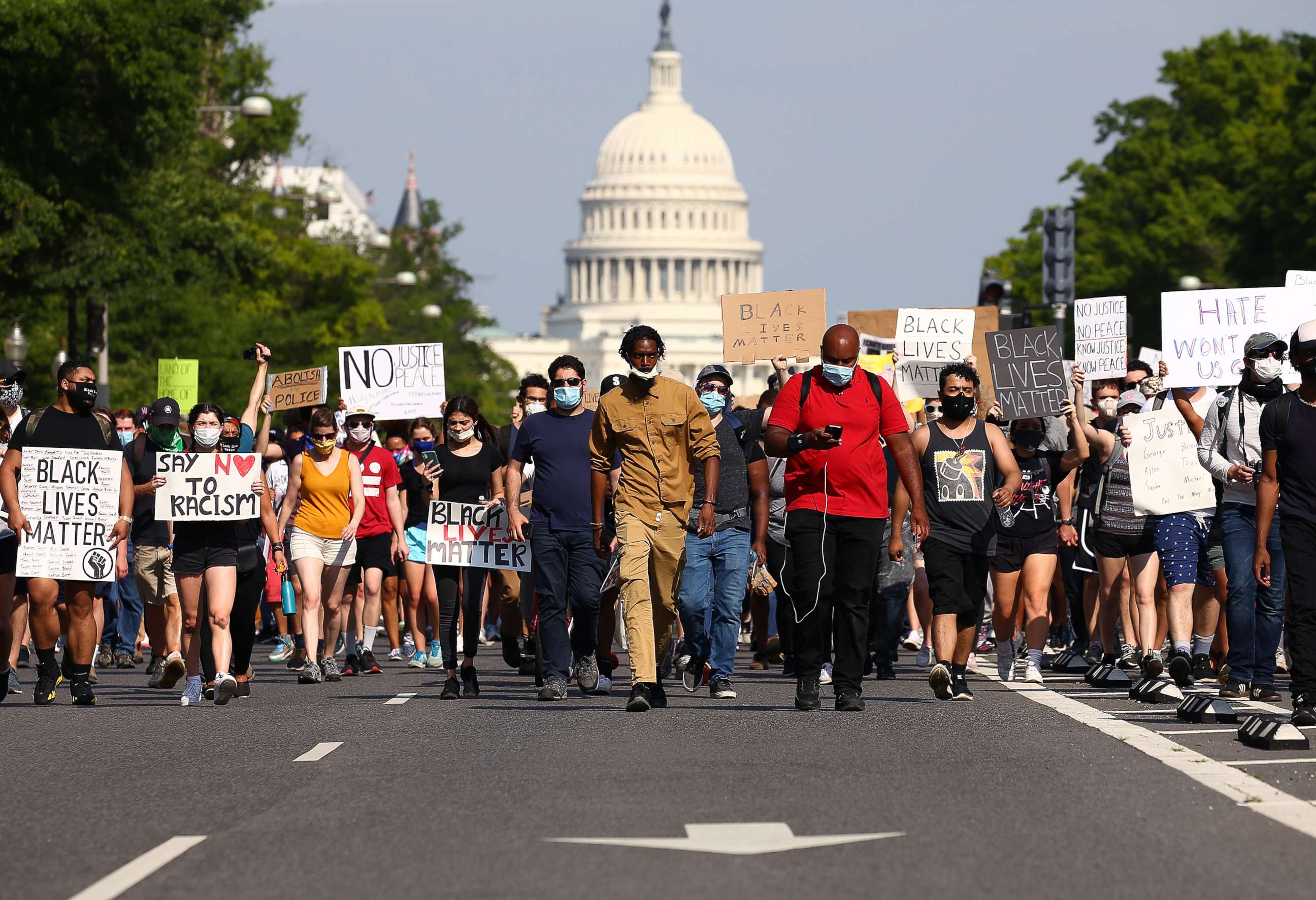 PHOTO: Demonstrators march down Pennsylvania Avenue during a protest against police brutality and the death of George Floyd, on June 3, 2020, in Washington, D.C.