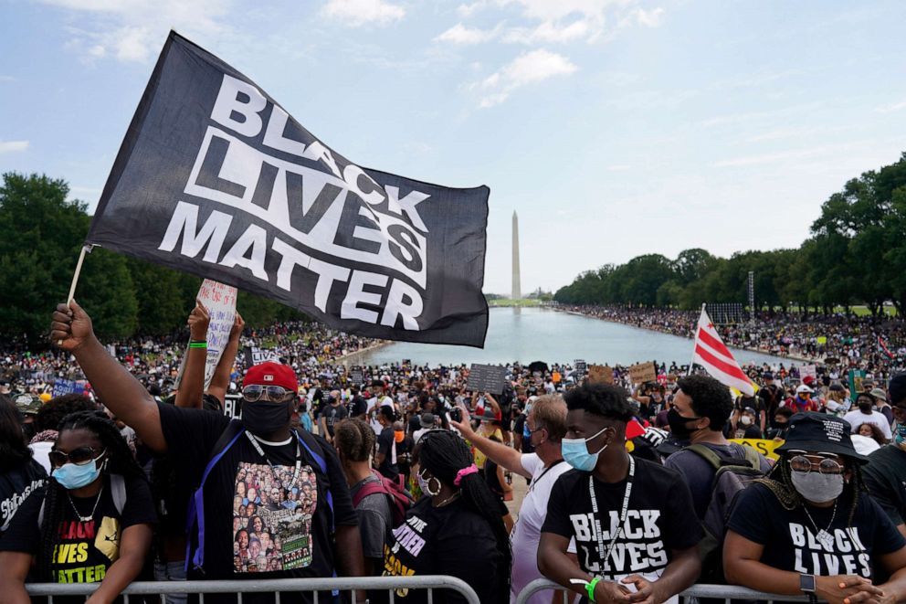 PHOTO: People attend the March on Washington, Aug. 28, 2020, in Washington, on the 57th anniversary of the Rev. Martin Luther King Jr.'s "I Have A Dream" speech.