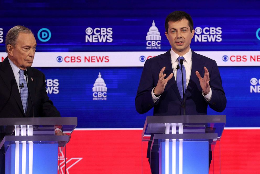 PHOTO: Democratic presidential candidate Pete Buttigieg speaks as former New York City Mayor Mike Bloomberg looks on during the Democratic presidential primary debate at the Charleston Gaillard Center, Feb. 25, 2020, in Charleston, South Carolina.