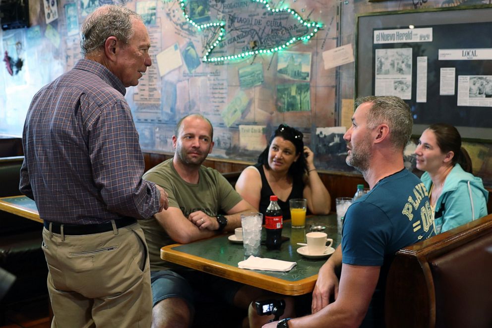 PHOTO: Democratic presidential candidate Mike Bloomberg speaks with people eating breakfast at El Pub Restaurant in the Little Havana neighborhood, in Miami, March 3, 2020. 