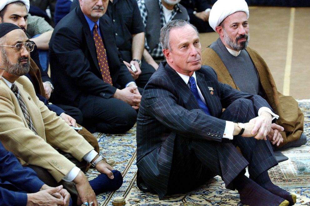 PHOTO: New York Mayor Michael Bloomberg sits with Imam Sheikh Fadhel Al-Sahlani at the Inam Al-Khoei Islamic Center, as they listen to a speaker on March 28, 2003, in the Queens borough of New York.