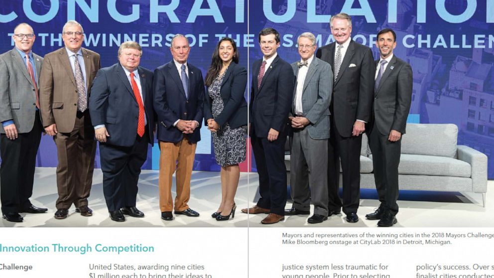 PHOTO: Michael Bloomberg appears in a photo with then-Mayor Pete Buttigieg and other mayors and city representatives in a photo from the Bloomberg Philanthropies 2019 Annual Report.