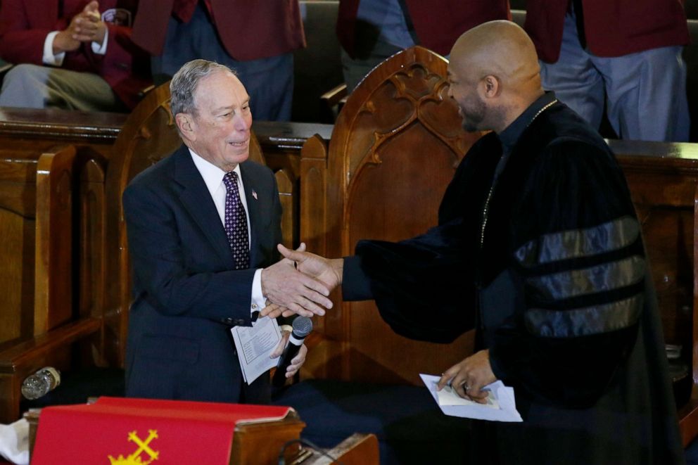 PHOTO: Democratic Presidential candidate Michael Bloomberg, left, greets the Rev. Robert Turner, right, during a service at the Vernon Chapel African Methodist Episcopal Church in Tulsa, Okla., Sunday, Jan. 19, 2020. 