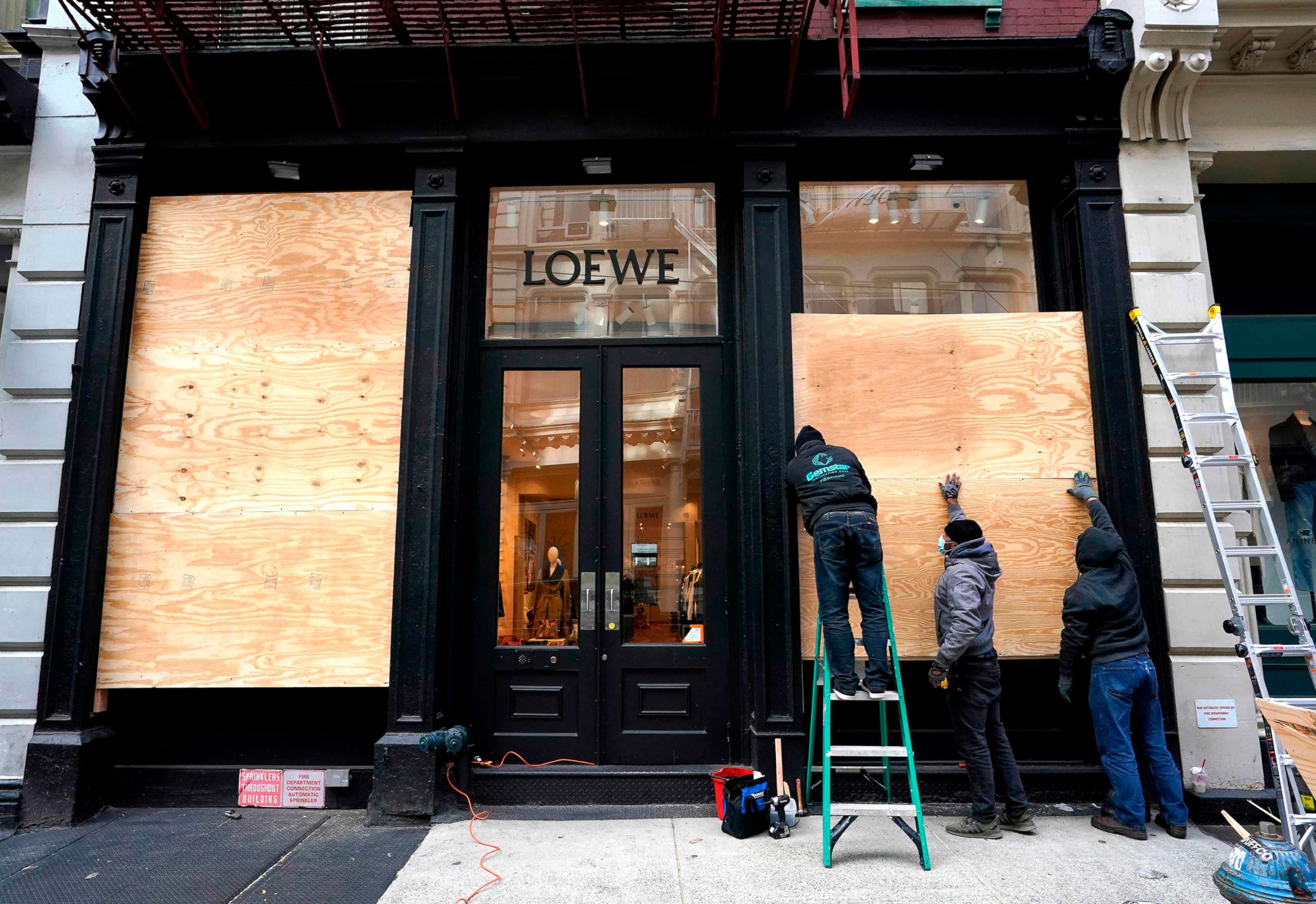 PHOTO: Workers in the Soho area of New York prepare their businesses by boarding up on Nov. 2, 2020, as they make plans for potential civil unrest during the presidential race for the White House.