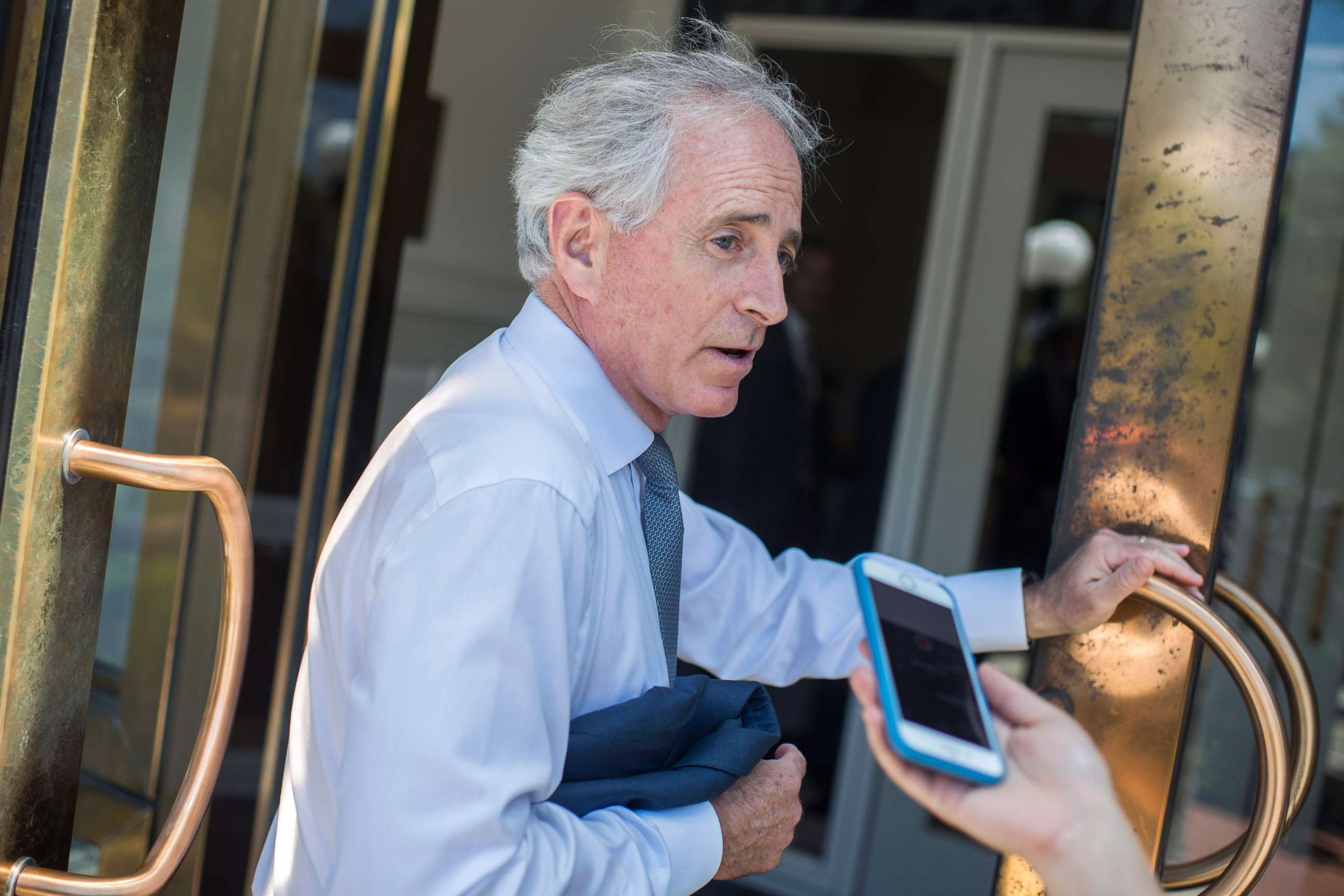 PHOTO: Sen. Bob Corker talks with reporters before the Republican Senate Policy luncheon at the National Republican Senatorial Committee, June 12, 2018.