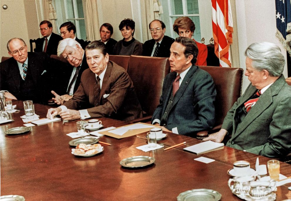 PHOTO: President Ronald Reagan meets with Senate Majority Leader Bob Dole and other congressional leaders in the White House's Cabinet Room, in Washington D.C., Jan. 4, 1985.