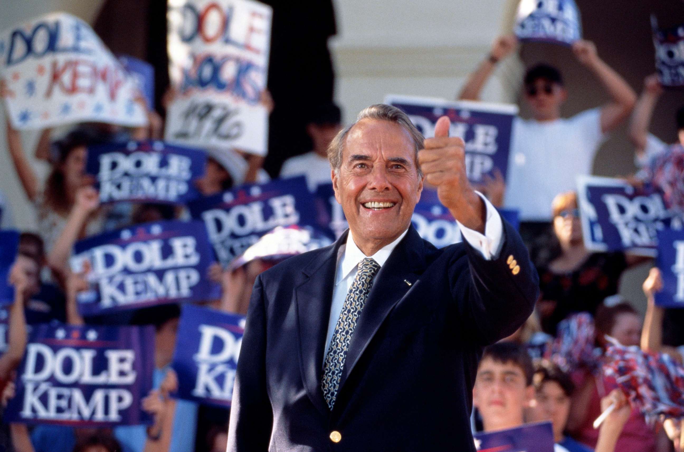 PHOTO: Sen. Bob Dole gives the "thumbs up" sign during a presidential rally in 1996.