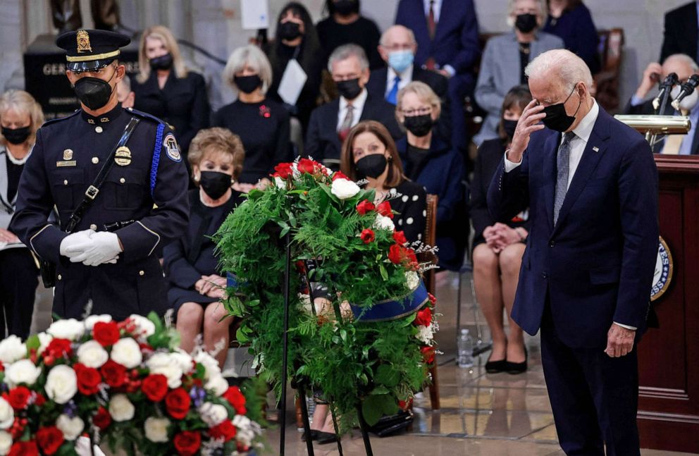 PHOTO: President Joe Biden crosses himself after delivering remarks near the casket of former Senator Bob Dole during a congressional lying in state ceremony in the U.S. Capitol Rotunda in Washington, D.C. on Dec. 9, 2021. 