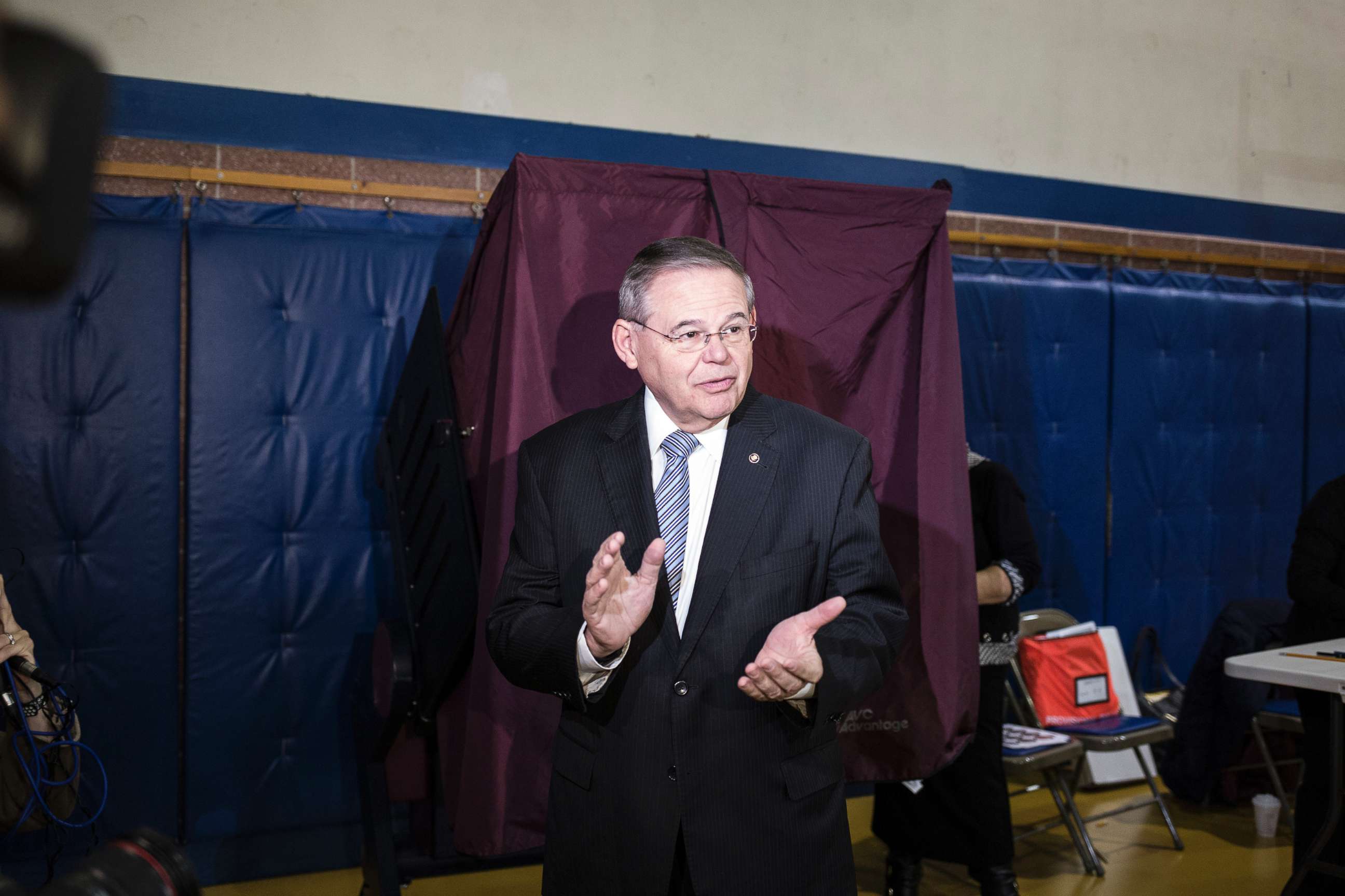 PHOTO: Sen. Robert Menendez walks from a poll after casting a ballot on Election Day morning at the community center in Harrison, N.J., Nov. 6, 2018.