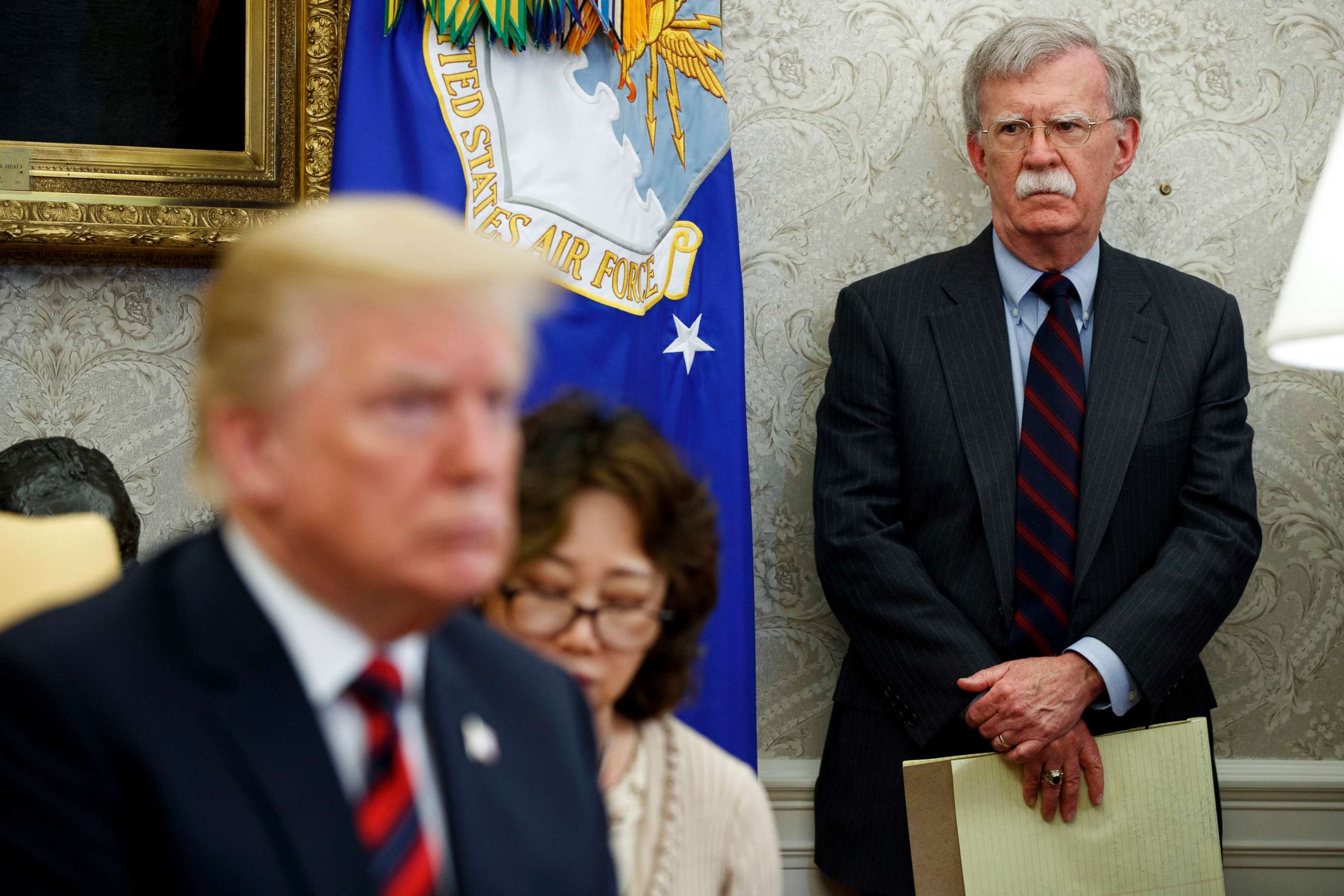 PHOTO: In this May 22, 2018, file photo, U.S. President Donald Trump, left, meets with South Korean President Moon Jae-In in the Oval Office of the White House in Washington, as national security adviser John Bolton, right, watches.