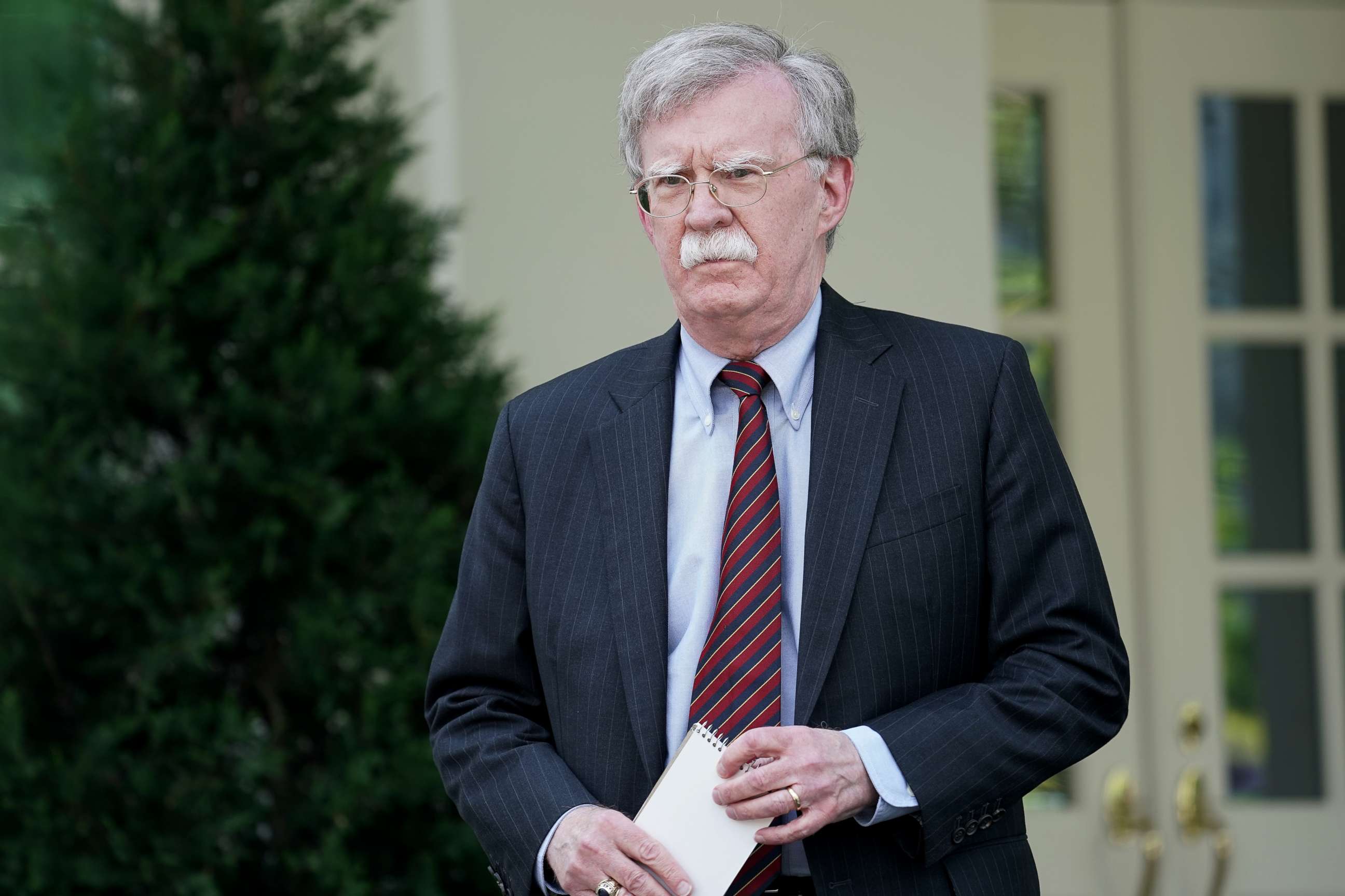 PHOTO: White House National Security Advisor John Bolton talks to reporters outside of the White House West Wing April 30, 2019 in Washington, DC.