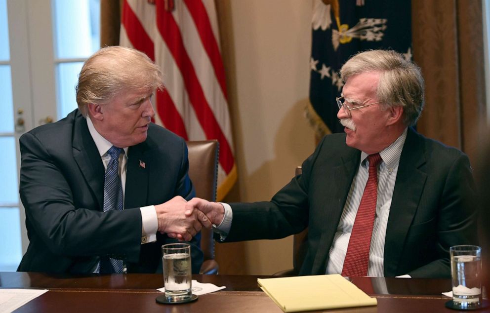 PHOTO: In this April 9, 2018 file photo, President Donald Trump, left, shakes hands with national security adviser John Bolton in the Cabinet Room of the White House in Washington at the start of a meeting with military leaders.