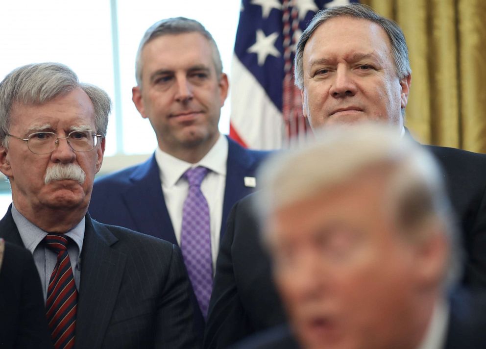 PHOTO: U.S. National Security Advisor John Bolton and Secretary of State Mike Pompeo listen as U.S. President Donald Trump speaks before signing a National Security Presidential Memorandum in the Oval Office February 7, 2019 in Washington, DC.