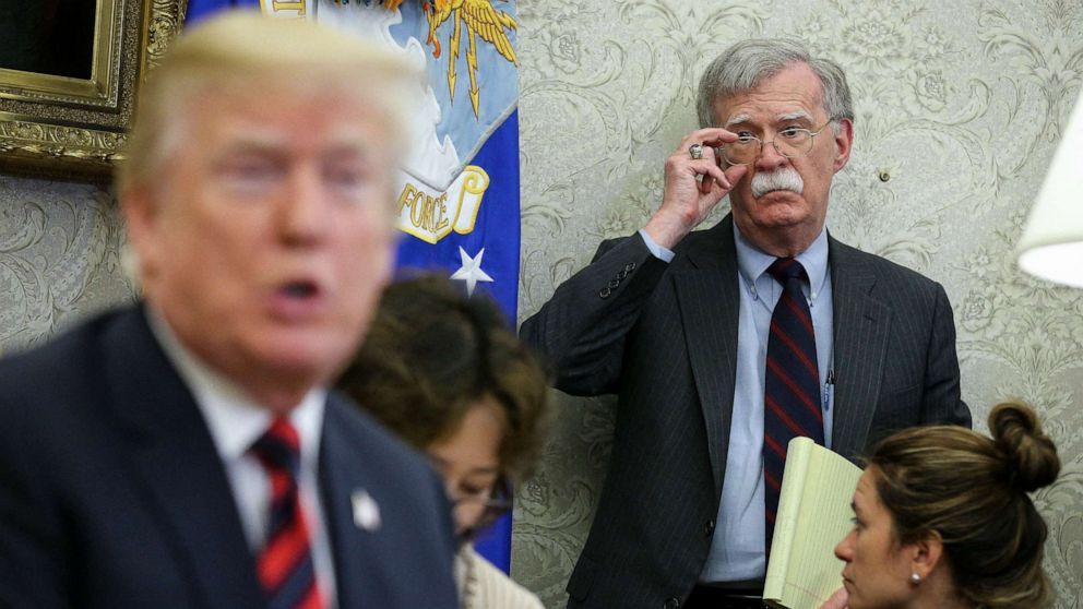 PHOTO: President Donald Trump speaks as National security advisor John Bolton listens during a meeting in the Oval Office of the White House on in Washington, May 22, 2018.