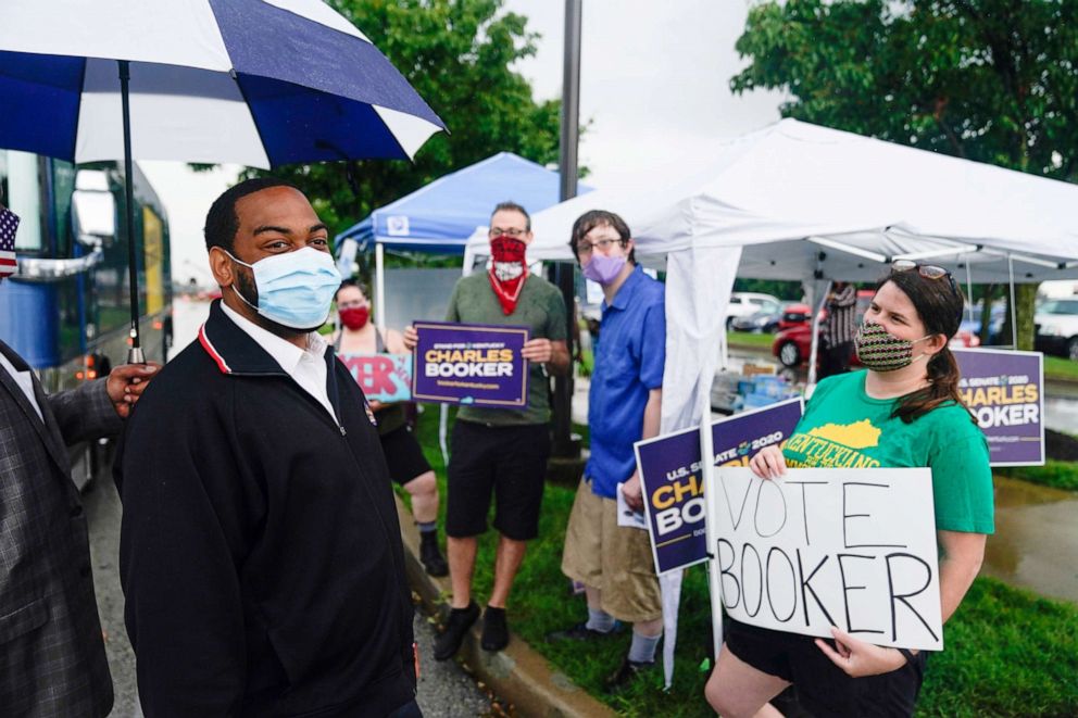 PHOTO: Kentucky State Representative and Democratic candidate for U.S. Senate Charles Booker greets supporters outside the only primary election polling place in Louisville, Kentucky, June 23, 2020.