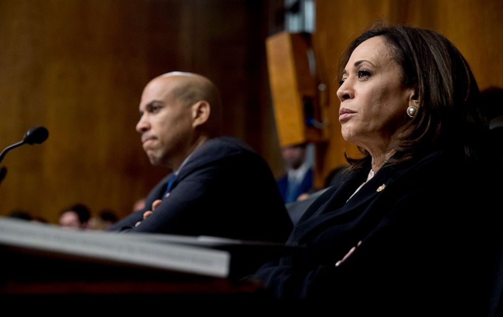 PHOTO: Democratic presidential candidates Sen. Cory Booker, left, and Sen. Kamala Harris, right, listen as Attorney General William Barr testifies during a Senate Judiciary Committee hearing on Capitol Hill in Washington, D.C., May 1, 2019.