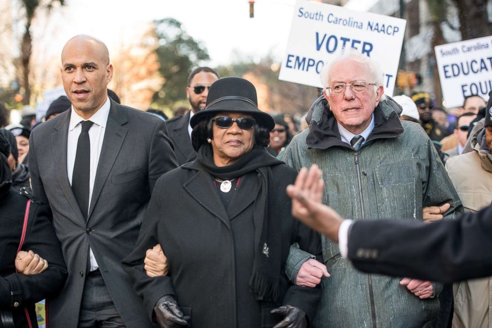 PHOTO: Sen. Bernie Sanders (I-VT), right, president of the South Carolina NAACP chapter, Brenda Murphy, center, and Sen. Cory Booker (D-NJ) march to the Statehouse in commemoration of Martin Luther King Jr. Day, Jan. 21, 2019, in Columbia, S.C.  