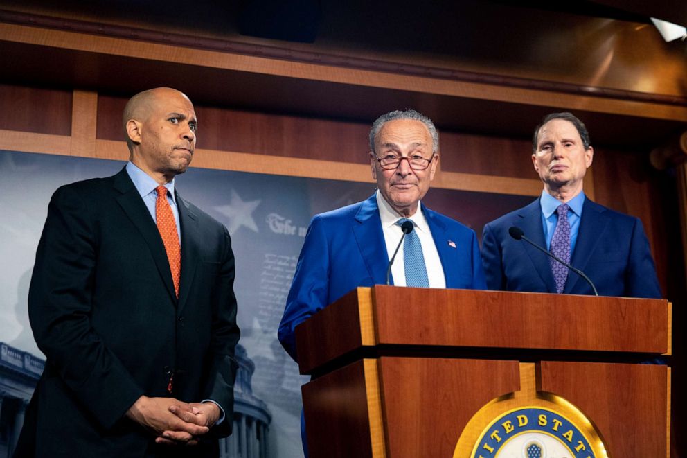 From left, Sen. Cory Booker, D-N.J., Senate Majority Leader Chuck Schumer, D-N.Y., and Sen. Ron Wyden, D-Ore., announce a draft bill that would decriminalize marijuana on a federal level Capitol Hill in Washington on July 14, 2021. 