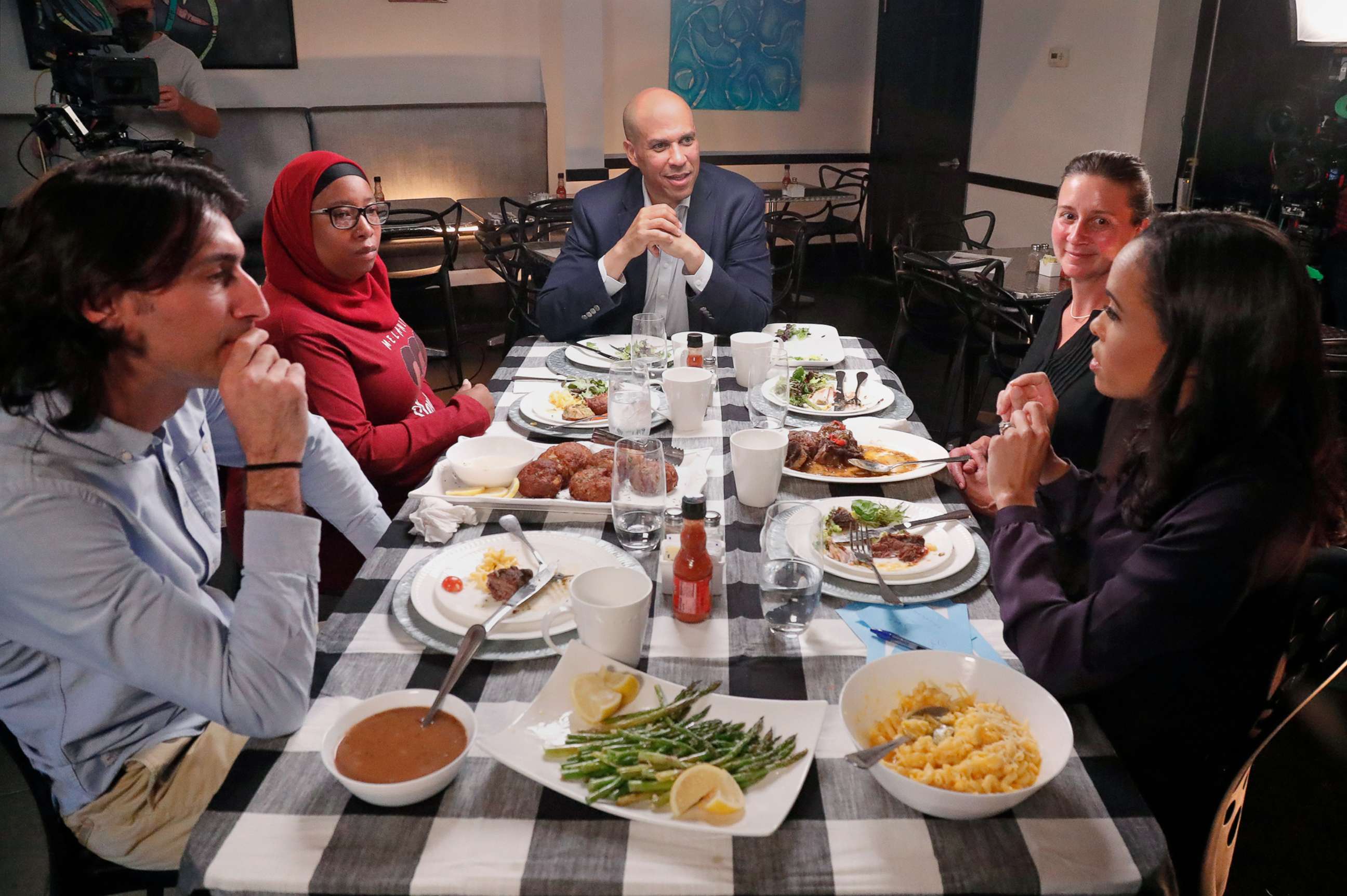 PHOTO: ABC News Correspondent Linsey Davis moderates a conversation with 2020 Democratic presidential candidate Cory Booker and three undecided voters at a restaurant in Newark, N.J., for the next installment of "Around the Table."