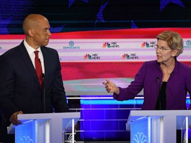 PHOTO: Cory Booker and Elizabeth Warren participate in the first Democratic primary debate hosted by NBC News at the Adrienne Arsht Center for the Performing Arts in Miami, Florida, June 26, 2019.
