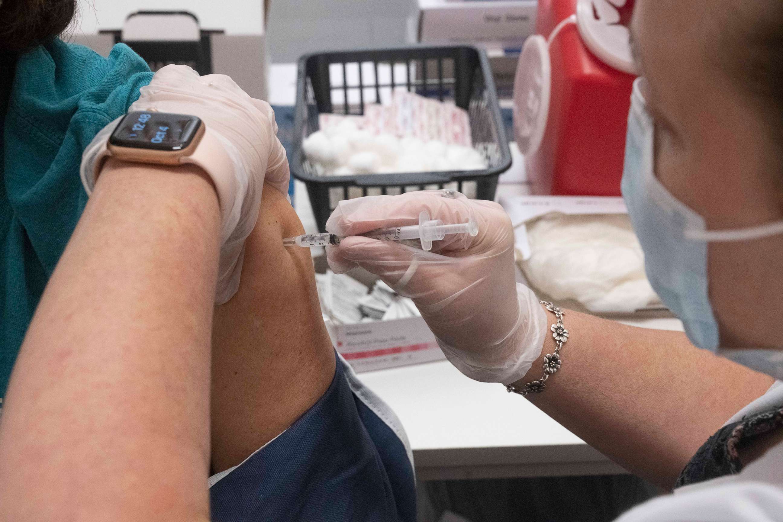 PHOTO: The booster shot for the Pfizer vaccine against COVID-19 is administered to a Texas resident over 65 at a pharmacy clinic in Austin, Texas, Oct. 4, 2021.