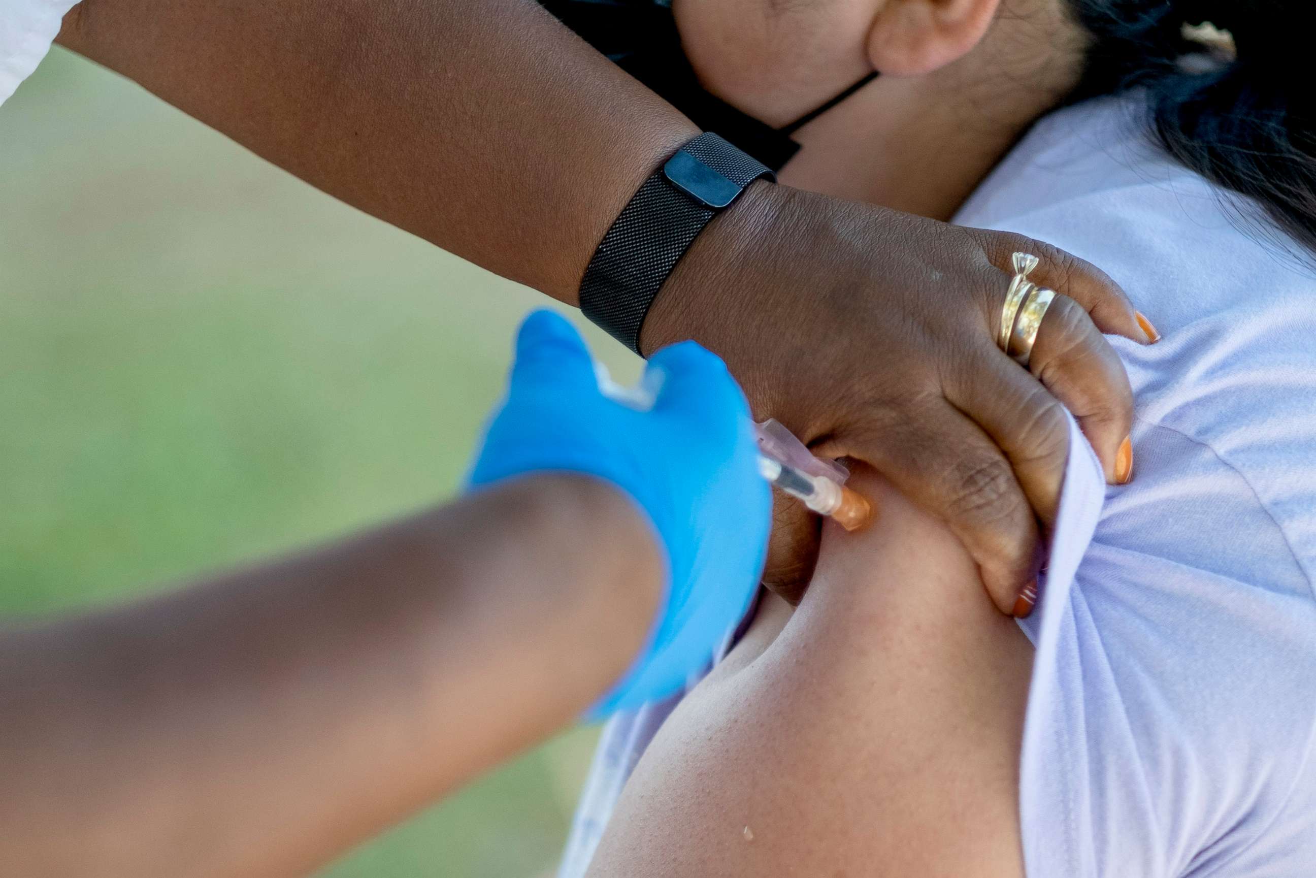 PHOTO: People receive booster shots during a COVID vaccination clinic in Pasadena, Calif., July 8, 2022. 