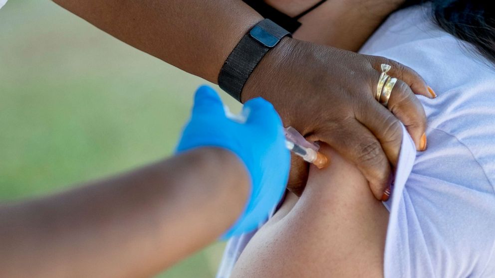 PHOTO: People receive booster shots during a COVID vaccination clinic in Pasadena, Calif., July 8, 2022. 