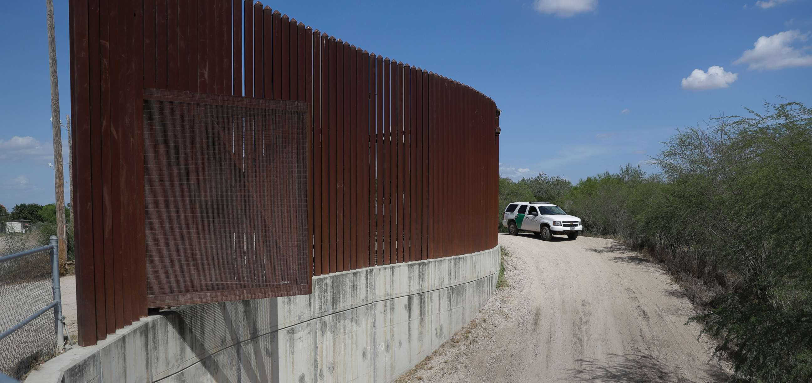 PHOTO: A U.S. Customs and Border Patrol vehicle passes along a section of border levee wall in Hidalgo, Texas, Aug. 11, 2017. 