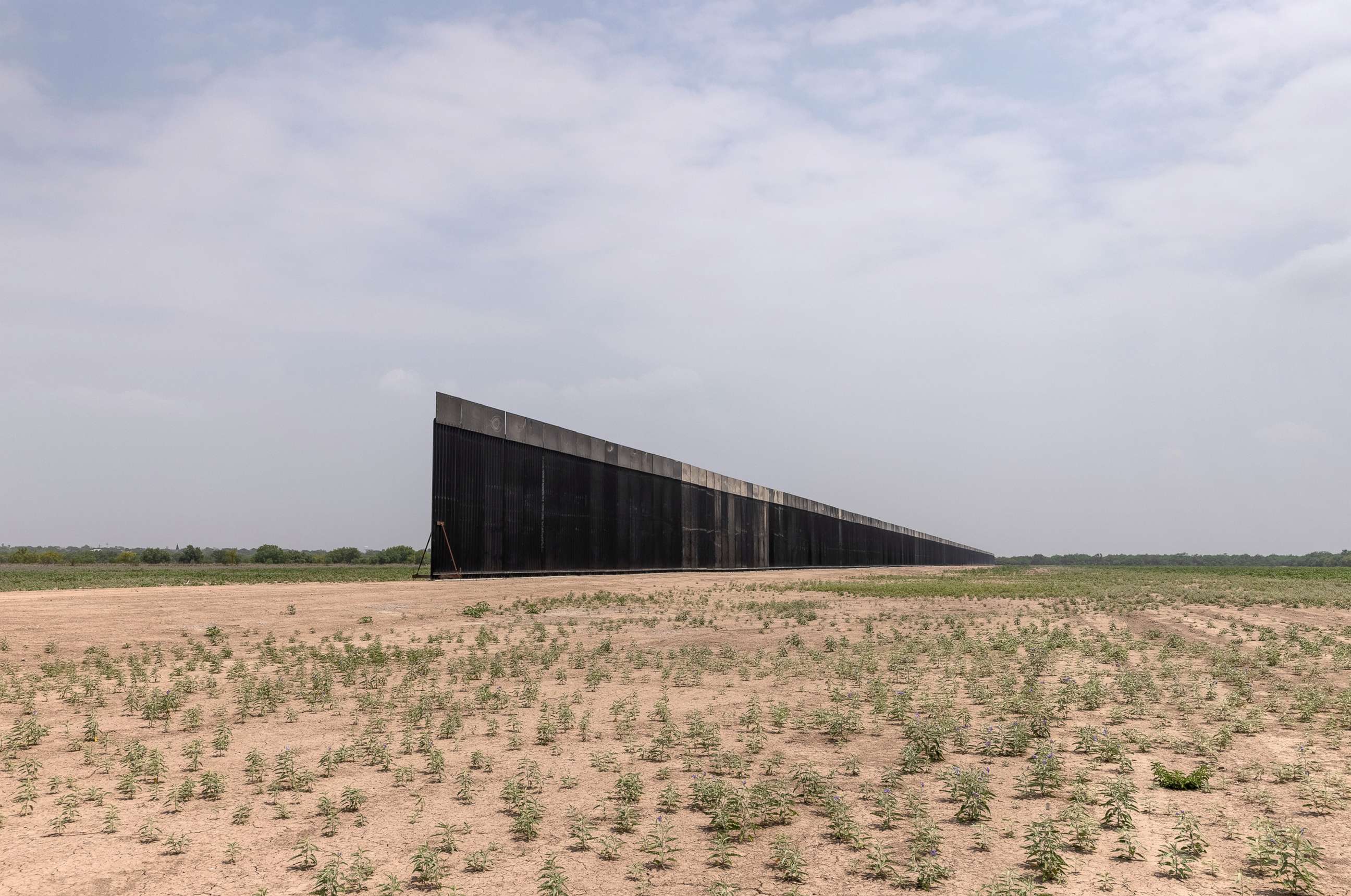 PHOTO: A portion of U.S.-Mexico border wall stands unfinished, April 14, 2021, near La Joya, Texas. 