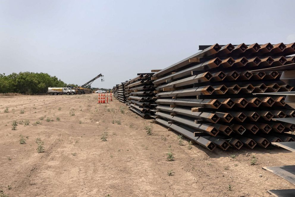 PHOTO: Unused pieces of steel bollard-style wall lay near a portion of unfinished border wall at the U.S.-Mexico border, April 14, 2021, La Joya, Texas.