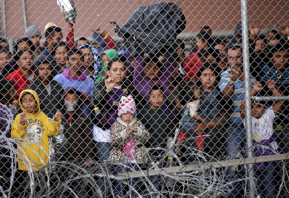 PHOTO: Central American migrants are seen inside an enclosure where they are being held by U.S. Customs and Border Protection (CBP), after crossing the border between Mexico and the United States, in El Paso, Texas, March 27, 2019. 