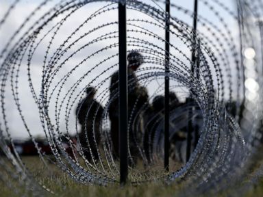 Militia leader arrested after holding migrants at gunpoint
