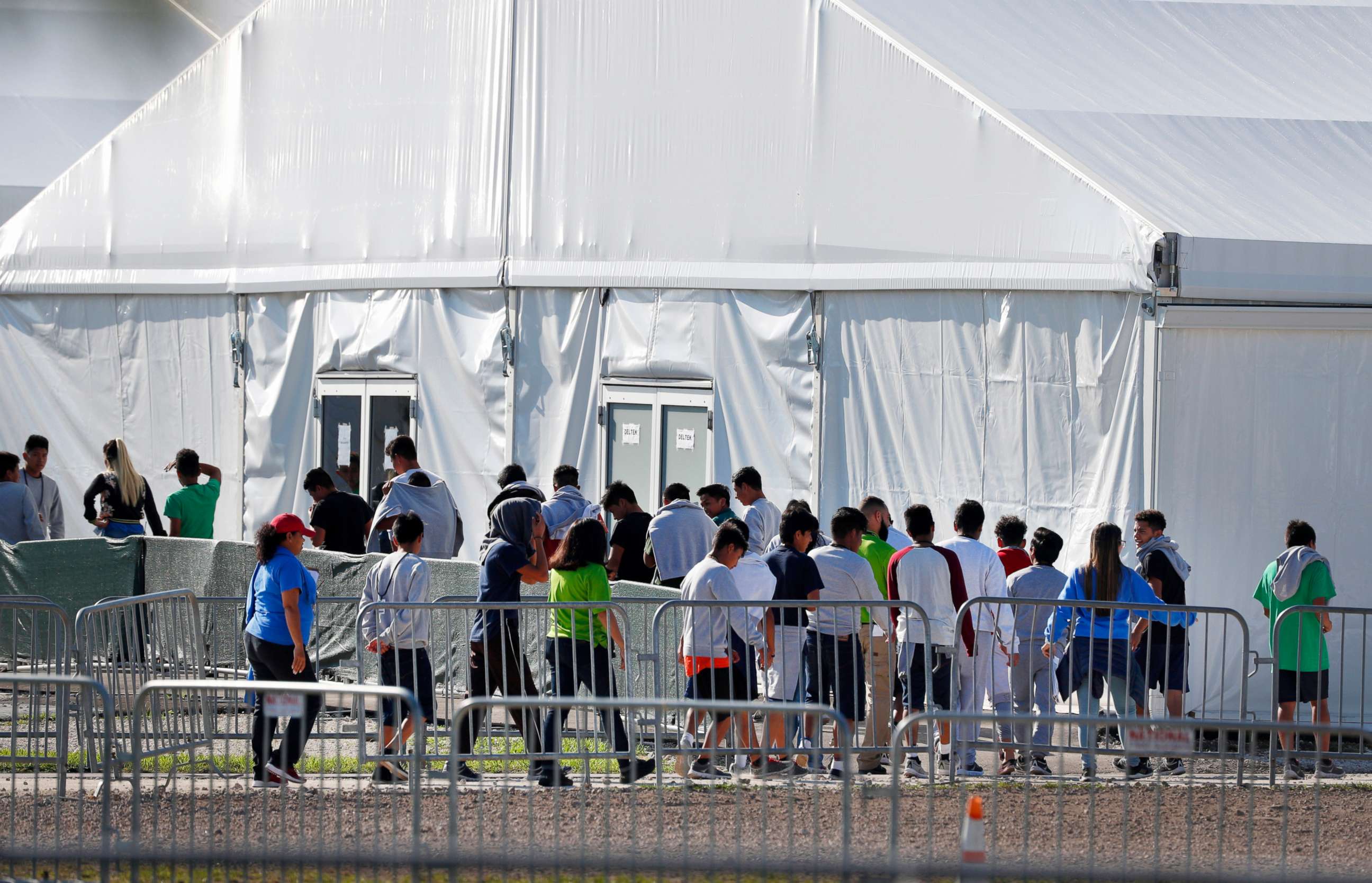 PHOTO: Children line up to enter a tent at the Homestead Temporary Shelter for Unaccompanied Children in Homestead, Fla., Feb. 19, 2019.