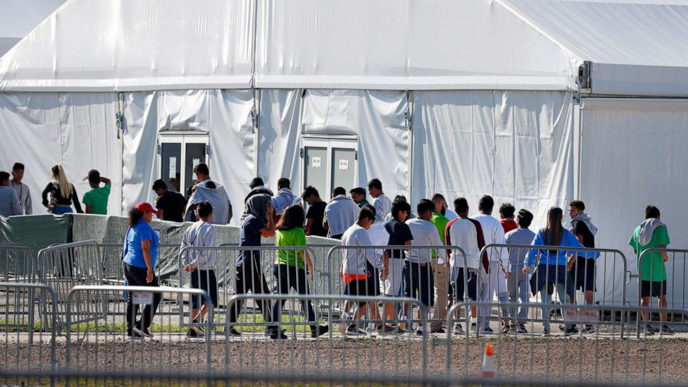 PHOTO: Children line up to enter a tent at the Homestead Temporary Shelter for Unaccompanied Children in Homestead, Fla., Feb. 19, 2019.