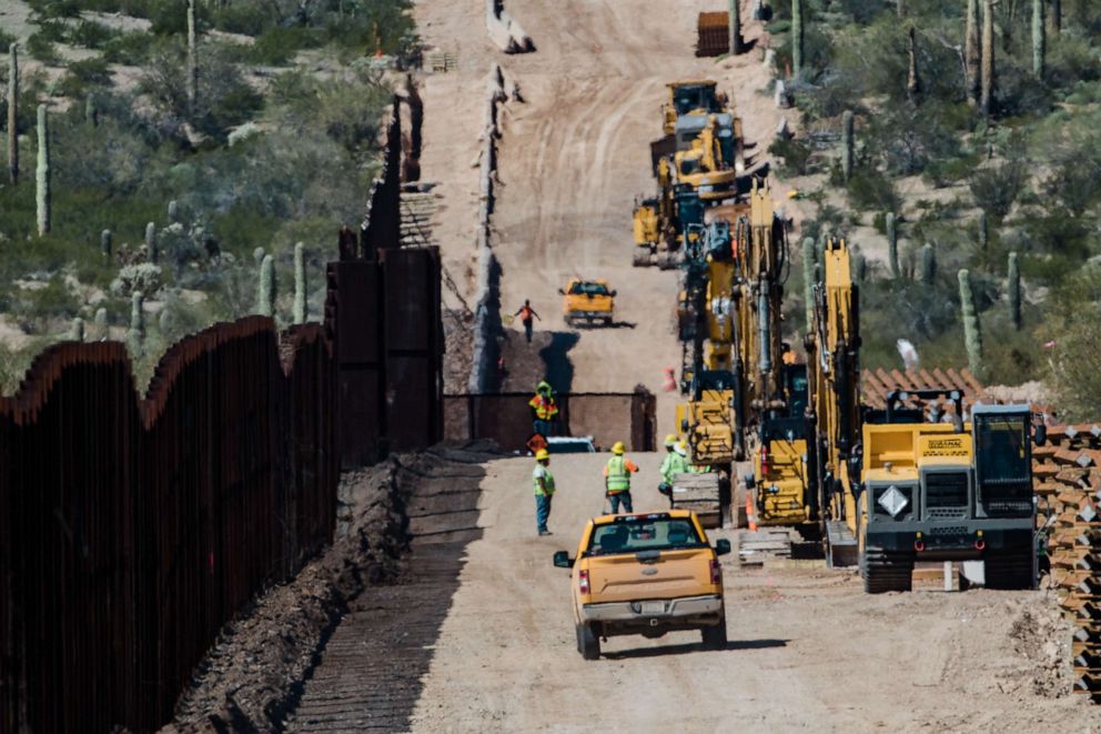 PHOTO: Contractors inspect the work site following detonations on Monument Hill to clear space for a new border wall in Lukeville, Arizona, U.S., on Wednesday, Feb. 26, 2020.